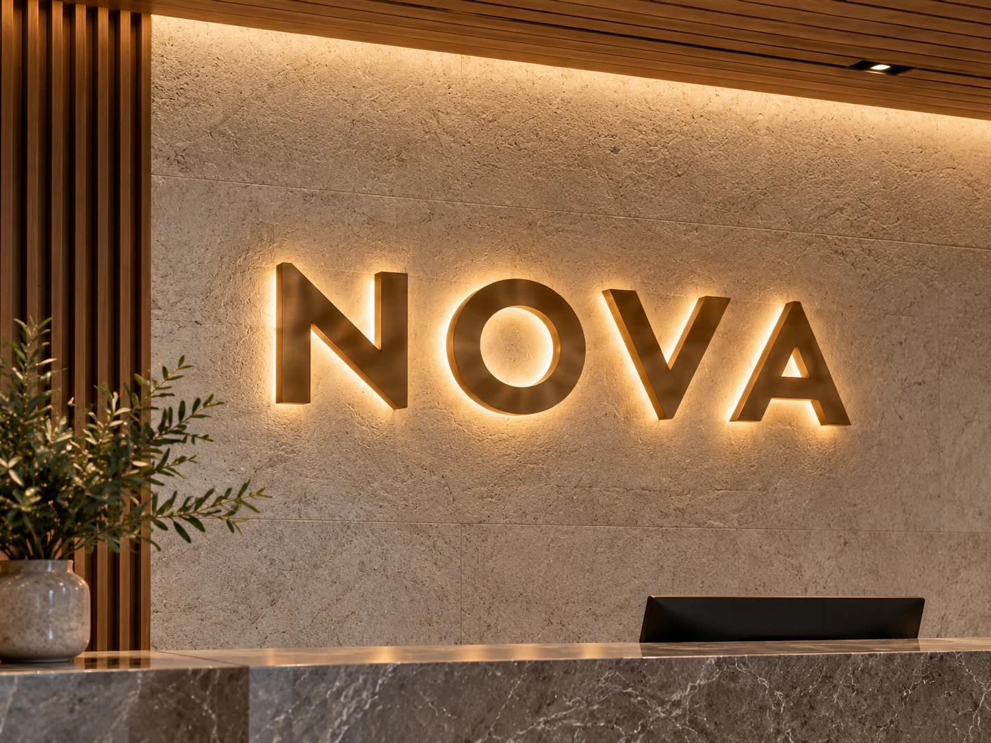 Warm halo-lit bronze letters on stone, design concept